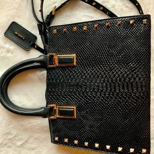 Bebe black purse, snake pattern.